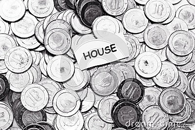 Save money concept, tag house above algeria coin Stock Photo