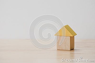 Save money for investment mortgage concept by wood block house Stock Photo