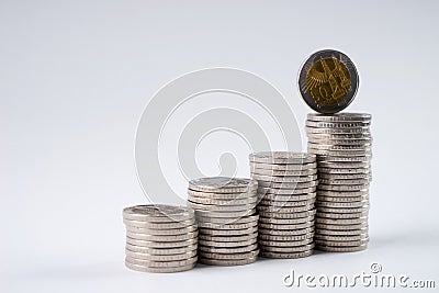 Save money with stack coins for growing your business. Stock Photo