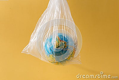 Save our planet or World Environment Day concept concept Earth plastic bag Stock Photo