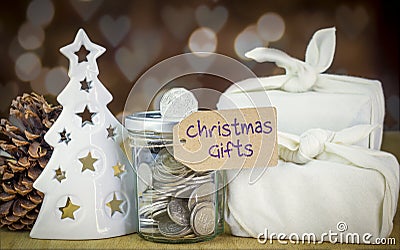 Saving jar containing coins with Christmas Saving label Stock Photo