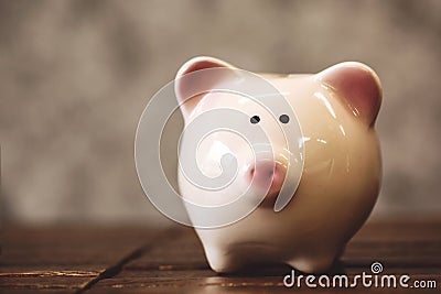 Saving money concept, coins in piggy bank Stock Photo