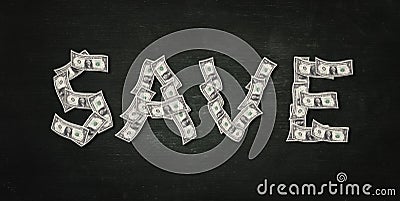 Saving money.Shape of save word make from dollar bills. Stock Photo