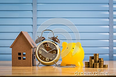 Saving money to buy a new home of its own money in the piggy bank. Lowest cost and tax. Stock Photo