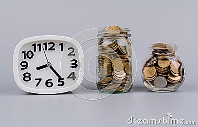 money and working time of money and time Wage stream, funds, coin bank Stock Photo