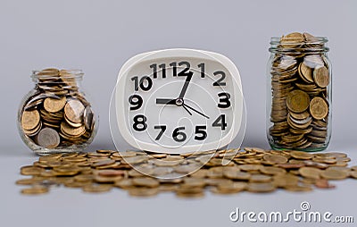 money and working time of money and time Wage stream, funds, coin bank Stock Photo