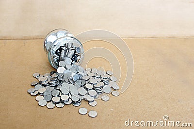 Saving plant and fruit, silver coins saving and investment in pandemic covid-19, protection mask clinical use Stock Photo