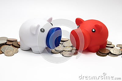 Saving money for a rainy day. Piggy banks on a white background. Savings and investments Stock Photo