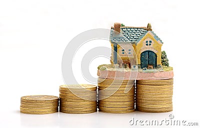 Saving to Buy House - Golden Stacks concept Stock Photo