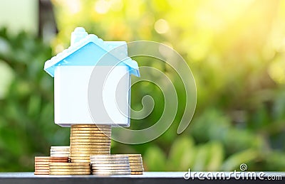 Saving to buy a house that stack coin growing ,yellow tone,savi Stock Photo