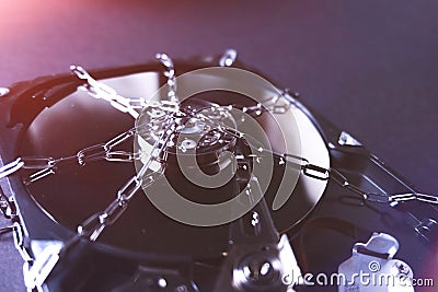Saving user data. Hacking a password on a PC. Closing access to files. Hackers and secret data. HDD and key with lock. Stock Photo