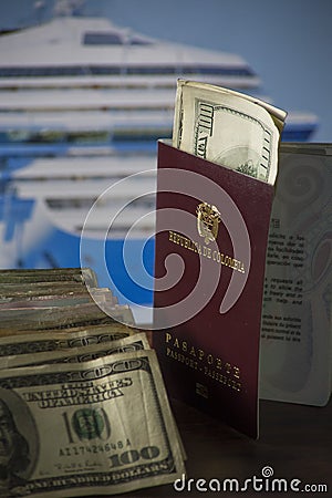 Savings destined to cruise by the sea- dollars and Colombian money with the cruise in the background Stock Photo