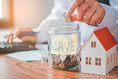 Savings, finances calculator counting money for Home concept Stock Photo