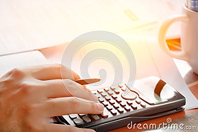 Savings, finances, economy and home concept - close up of man with calculator counting making notes at home Stock Photo