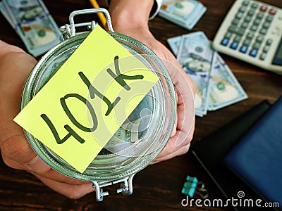 Savings for retirement. 401k plan concept. Jar and money in it. Stock Photo