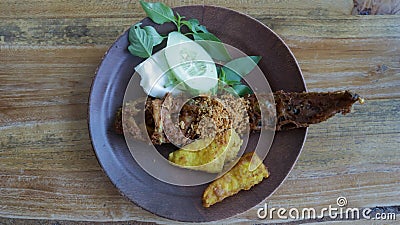 Savor Pecel Lele or pecak lele East Java's delight. Stock Photo