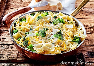 Savory broccoli bow tie pasta with lemon Stock Photo