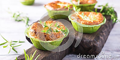 Savory cheddar cheese and leek mini quiches Stock Photo