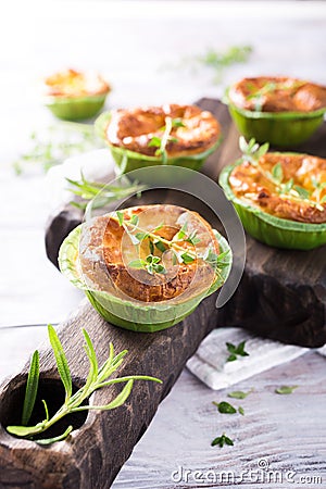 Savory cheddar cheese and leek mini quiches Stock Photo