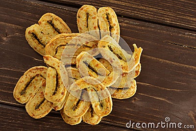 Savory cheese palmier on brown wood Stock Photo