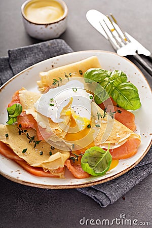 Savory crepes with salmon and egg Stock Photo