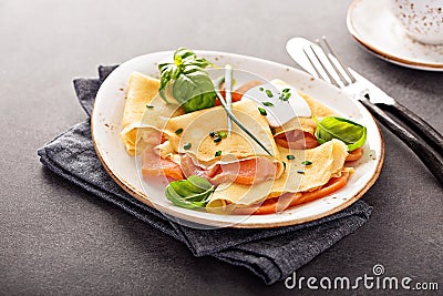 Savory crepes with salmon filling Stock Photo