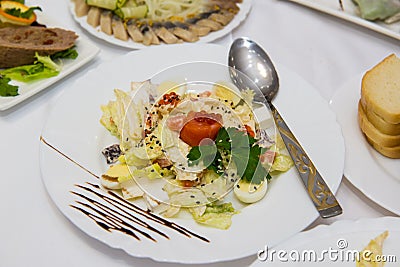 Savory fish portion : roasted norwegian salmon chunks with lemon and vegetable salad , rosemary twig and red caviar in Stock Photo