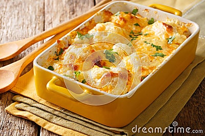 Savory food: baked cauliflower with cheese, eggs and cream close Stock Photo