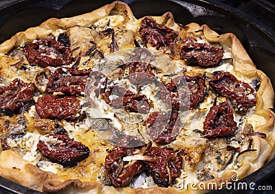 Savory pie with ricotta, bacon and dried tomatoes Stock Photo