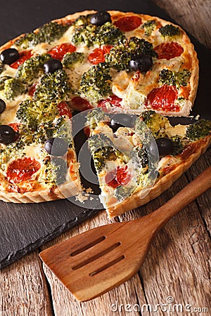 Savory Pie: Sliced Quiche with chicken, broccoli, tomatoes and o Stock Photo