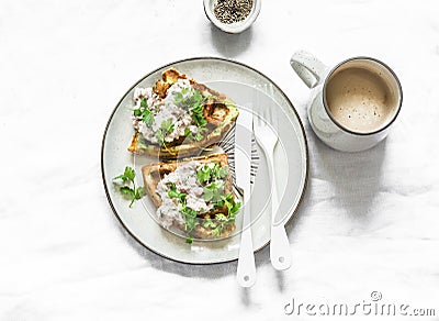 Savory zucchini waffles with tuna, cream cheese pate and coffee on a light background, top view. Delicious healthy breakfast, Stock Photo