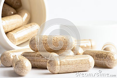 Saw Palmetto Capsules Spilled from a Bottle Stock Photo