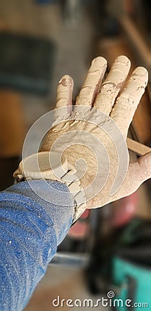 Sawdust. Dirty hands equal clean money. Stock Photo