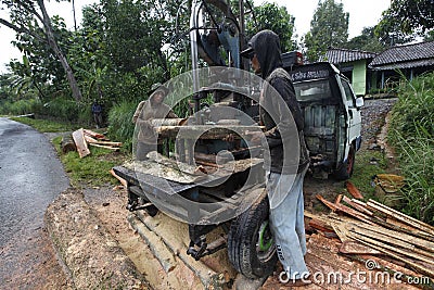Sawing wood Editorial Stock Photo