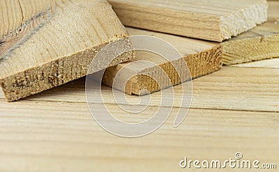 Sawn boards lie on the wooden surface.Construction materials from pine Stock Photo