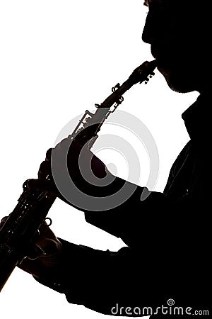 Saxafon on a white background in the hands of a musician silhouette Stock Photo