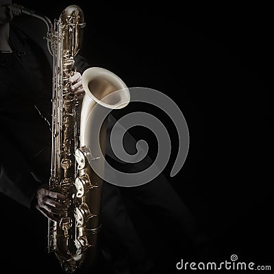 Saxophone player saxophonist with sax baritone Stock Photo