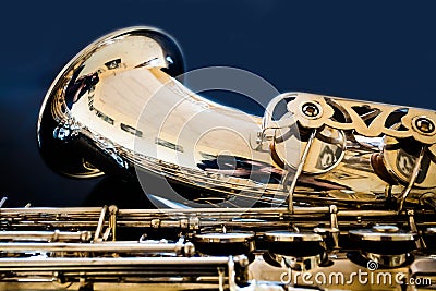 Saxophone tenor. Woodwind Classical Instrument. Jazz, blues, classics. Music. Saxophone on a black background. Black mirror surfac Stock Photo