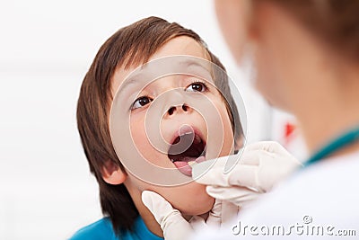 Say aaah - little boy at the doctor Stock Photo