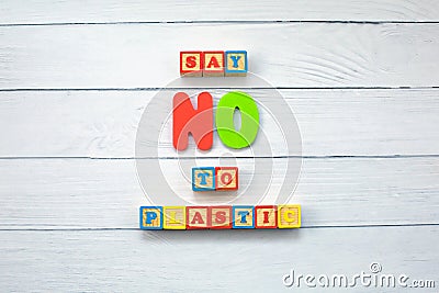 Say NO to plastic - on wooden cubes on wood background. Environmental, pollution concept Stock Photo