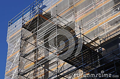 Scaffold and safety net at a building Stock Photo