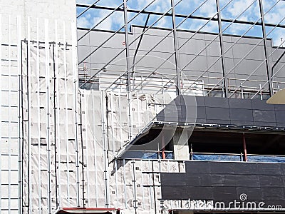 Scaffolding and Cladding on Mid-Rise Construction Site Stock Photo