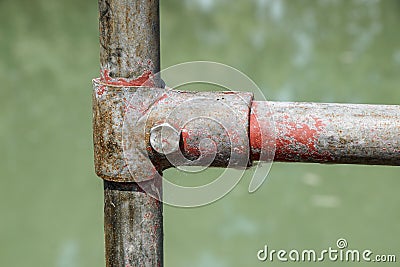 Scaffolding pipe clamp and parts, An important part of building strength to scaffold clamps in used close up on Stock Photo