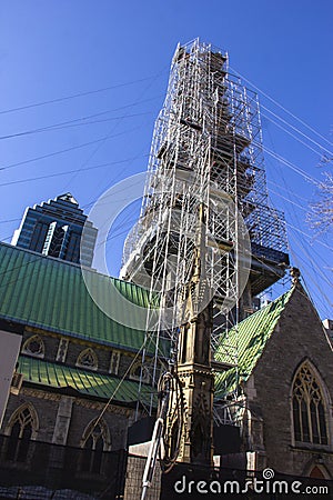 Church spire surrounded by scaffolding Stock Photo