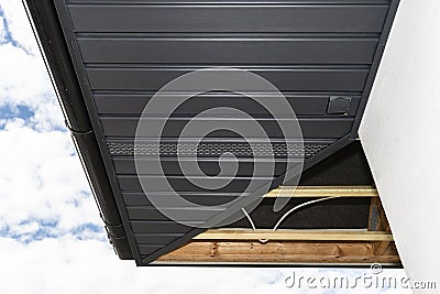 Scaffolding With Three Rows Of Wooden Battens And A Modern Graphite
