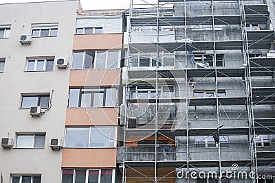 Scaffoldings on the facade of a block of flats Stock Photo