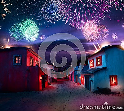 Scale model of a typical mexican village at night with fireworks Stock Photo