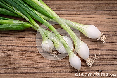 Scallions on a wooden board Stock Photo