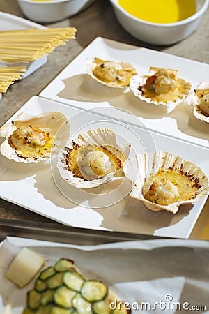 Scallops au gratin are a tasty and refined seafood appetizer, perfect for special and festive occasions. It is a simple Stock Photo