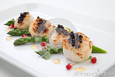 Scallops and Black Caviar Stock Photo